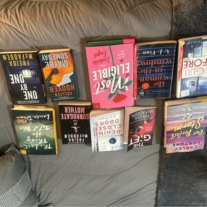 Assorted Paperback Books - Pink, Blue, Orange, Black Covers
